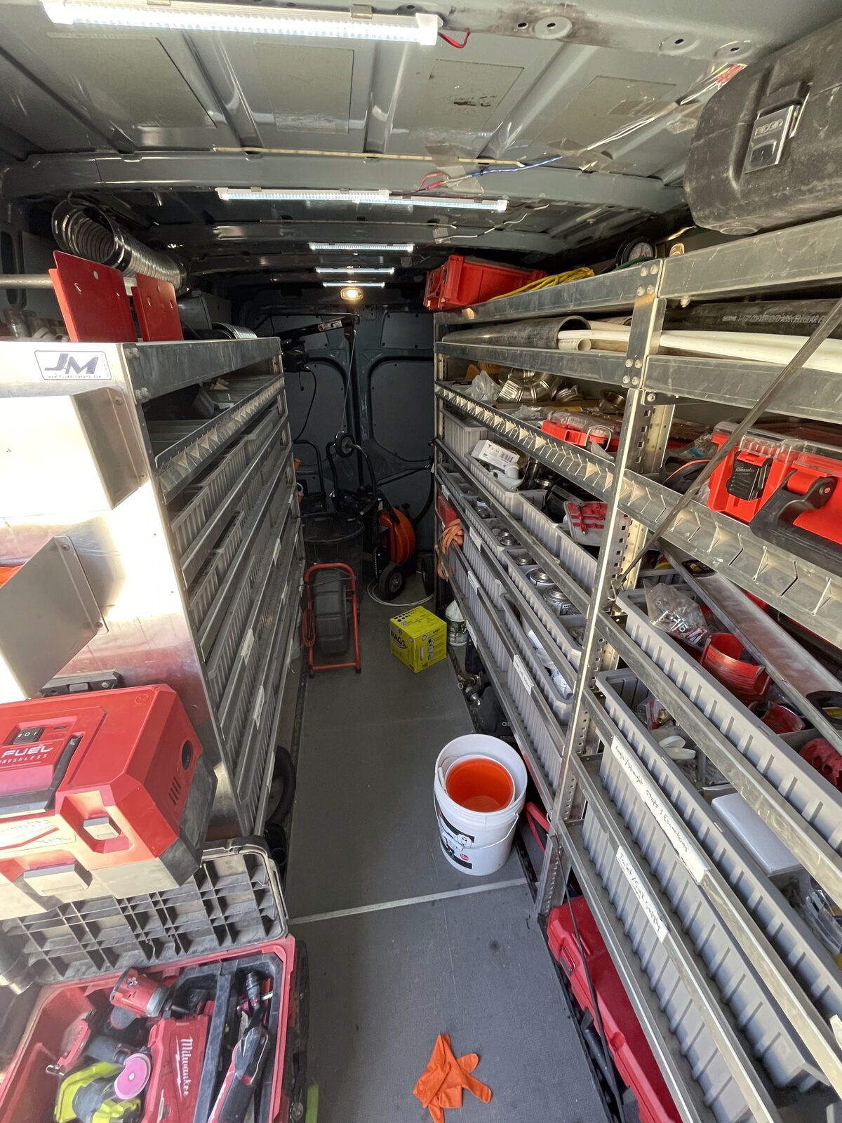 Inside a stocked plumbing service van